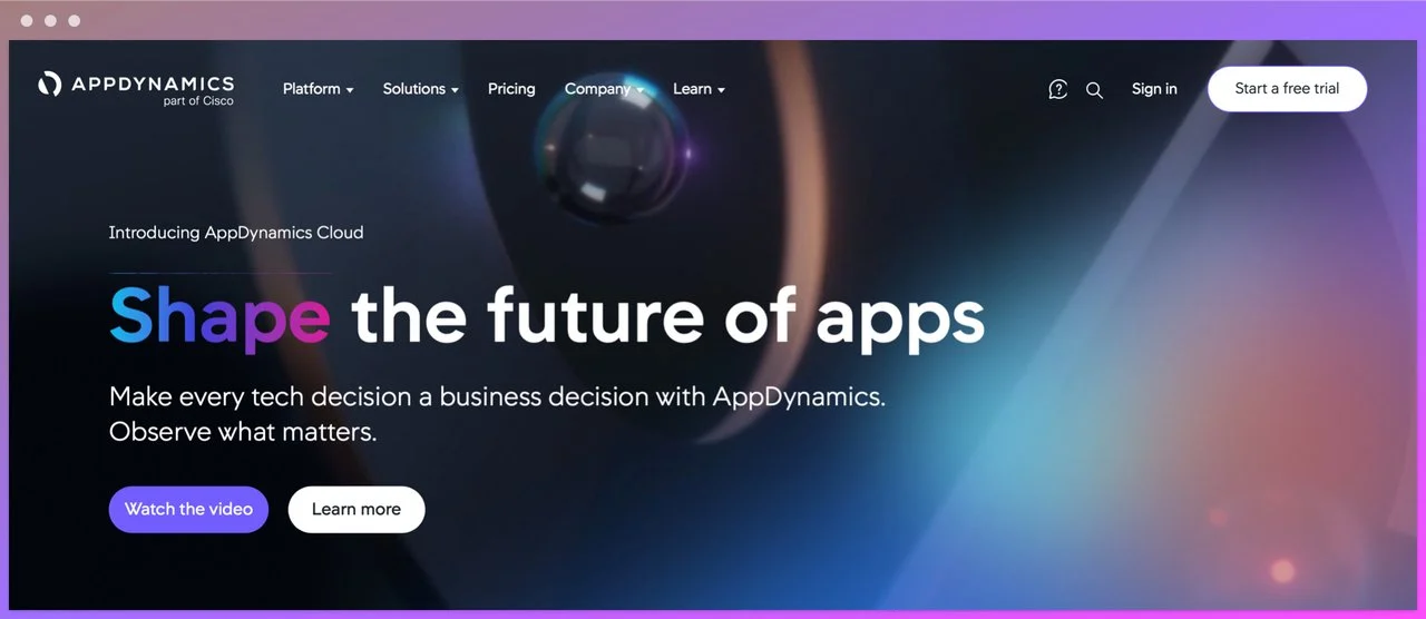 appdynamics homepage with the headline shape the future of the apps on the left on a camera lens kind of background and watch the video learn more buttons below