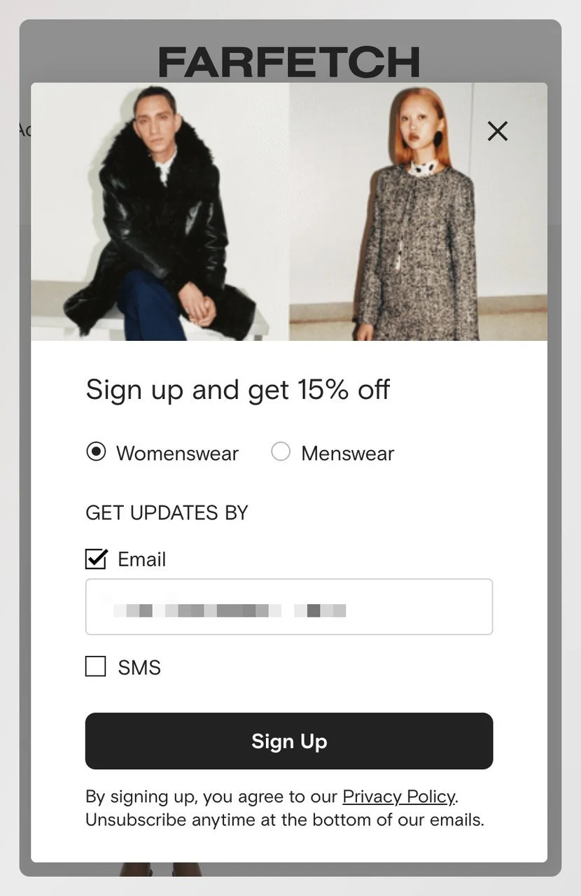 a screenshot of a cart abandonment popup example from Farfetch asking visitors to sign up to get 15% off