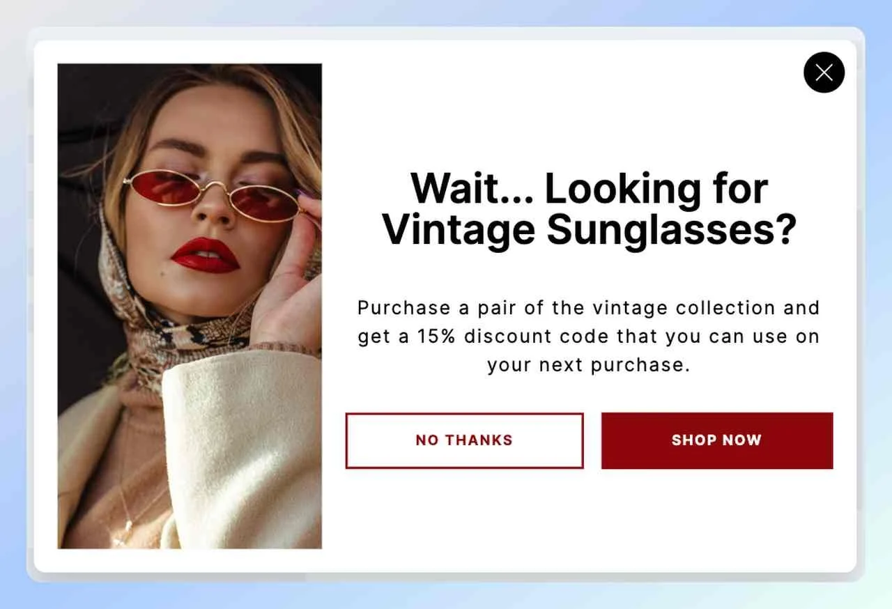 a screenshot of a cart abandonment popup example from Popupsmart with a picture of a girl with red eyewear