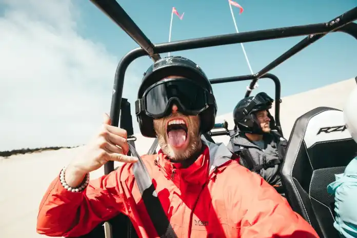 Oltre 450 migliori foto e selfie di didascalie di Instagram nel 2022 8 man showing his tongue while riding on ATV